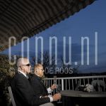 14-10-2004 Joop Braakhekke and Wim Nijkamp at home in Amsterdam, by order of Pulse Magazine, October 14, 2004. 

[keywords]Balcony, Sunglasses, Champagne[/keywords]